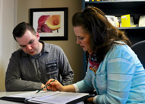 Amanda Nell working with an employee