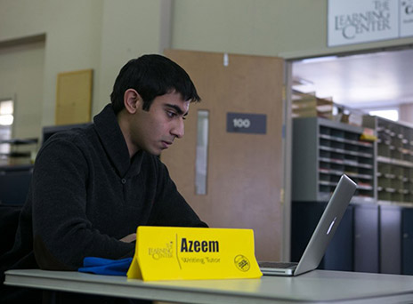 Azeem Khan in the Writing Center